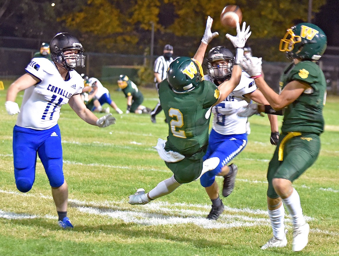 Whitefish reciever Bodie Smith lays out to catch a pass in a game against Corvallis on Friday night. (Whitney England/Whitefish Pilot)