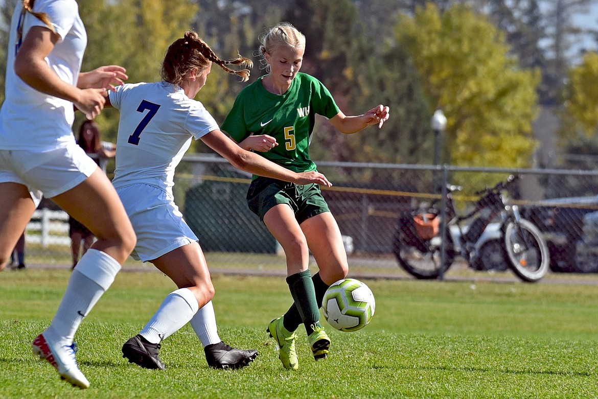 Whitefish freshman midfielder Isabelle Cooke controls the ball against CFalls' Maddie Robison at Smith Fields on Saturday. (Whitney England/Whitefish Pilot)