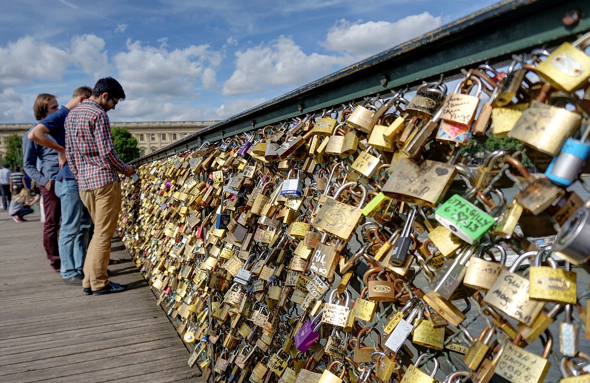 A tradition of lovers attaching a padlock to the Milvian Bridge and throwing the key into the river was adopted from a novel to symbolize eternal love, but is now banned by authorities who have removed the locks, considering them vandalism.