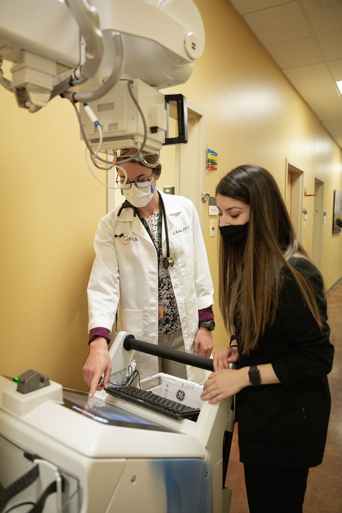Columbia Basin Health Association physician assistant Jesstine Kane (right) and radiology technician Alyiah Martinez check images on the new x-ray machine at CBHA's Connell clinic.