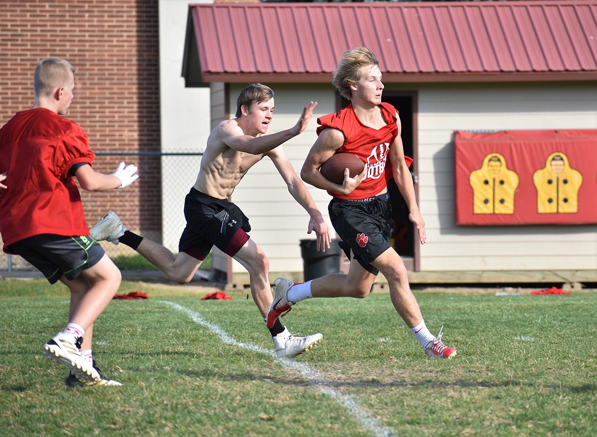 Trevan Adam (left) reaches out to try and make a "tackle" on Wednesday.