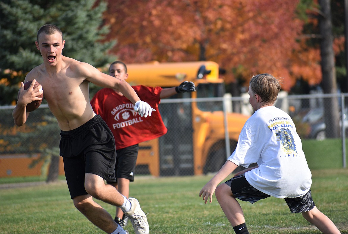 Zac Whittom jukes a middle school defender on Wednesday.