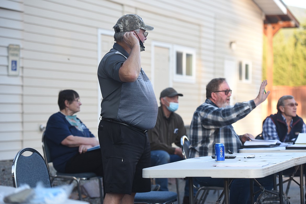 Robin Swimley, chairman of the Fisher River Fire Service Area Board and Lincoln County Commissioners Mark Peck (D-1) and Jerry Bennett (D-2) address residents at public meeting on a proposed fee hike on Sept. 30.
