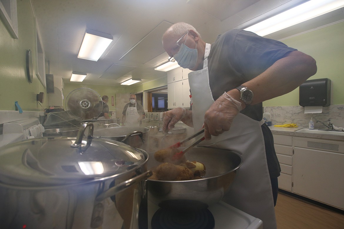 Dave Childs boils potatoes at Trinity Lutheran Church Wednesday.