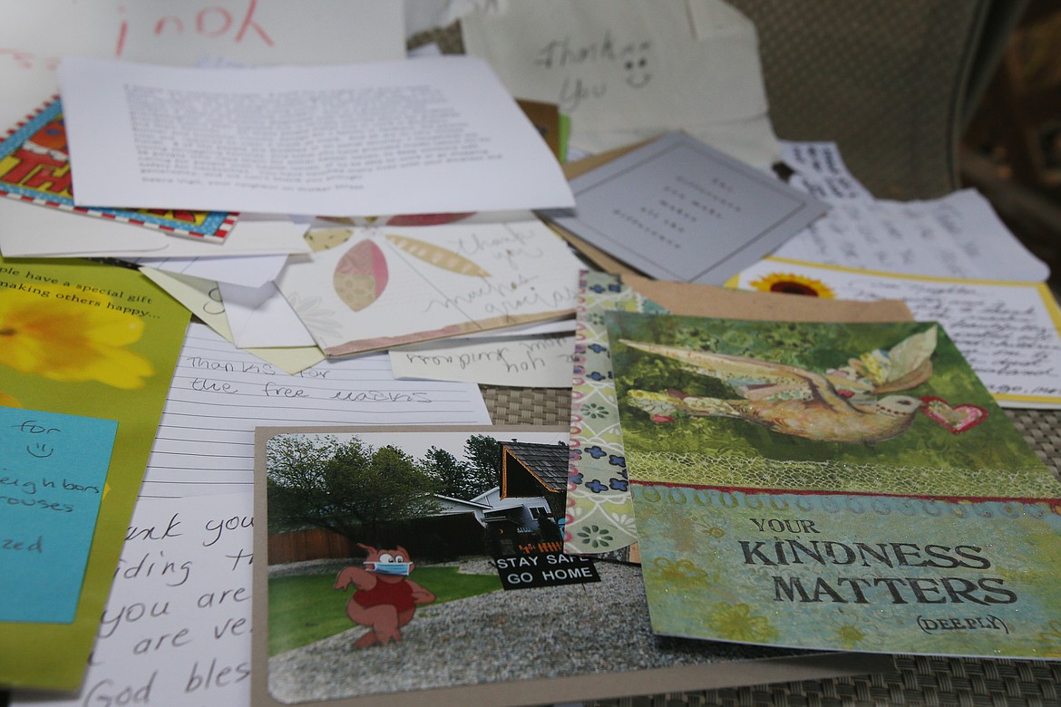 Thank-you letters, notes of appreciation and other tokens of gratitude have appeared on the table at the end of Ann Shehan's driveway, where she leaves a box filled with free handmade masks for anyone to take.