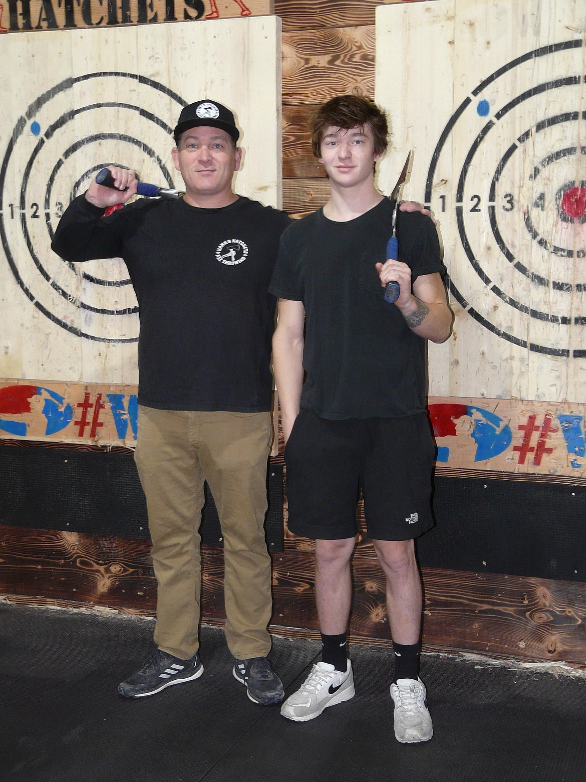 Owners Jared (Hank) D'Andrea and son Ezra Evans are seen at Hank's Hatchets, a new indoor ax-throwing venue that will open Friday at 2506 N. Fourth St., Coeur d'Alene.