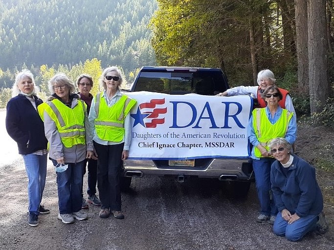 Daughters of the American Revolution, Chief Ignace Chapter, Kalispell, completed their annual “Adopt-A-Highway” service project recently. Their 2-mile area lies east of the West Glacier Park entrance. 
Pictured from left to right: Maggy Kuska, Carol Savage, Janice Olson, Susan Land, Jeanne Hogan, Patricia Gillies and Barbara Alsbury, kneeling. Not pictured: Chapter Regent Cate Webber, who photographed the group. 
Individuals, families, organizations, business large and small, nonprofit organizations, religious groups and schools are all welcome to adopt a highway in Montana.
For Flathead County, contact Melissa Paradis with the Montana Department of Transportation via email at mparadis@mt.gov.