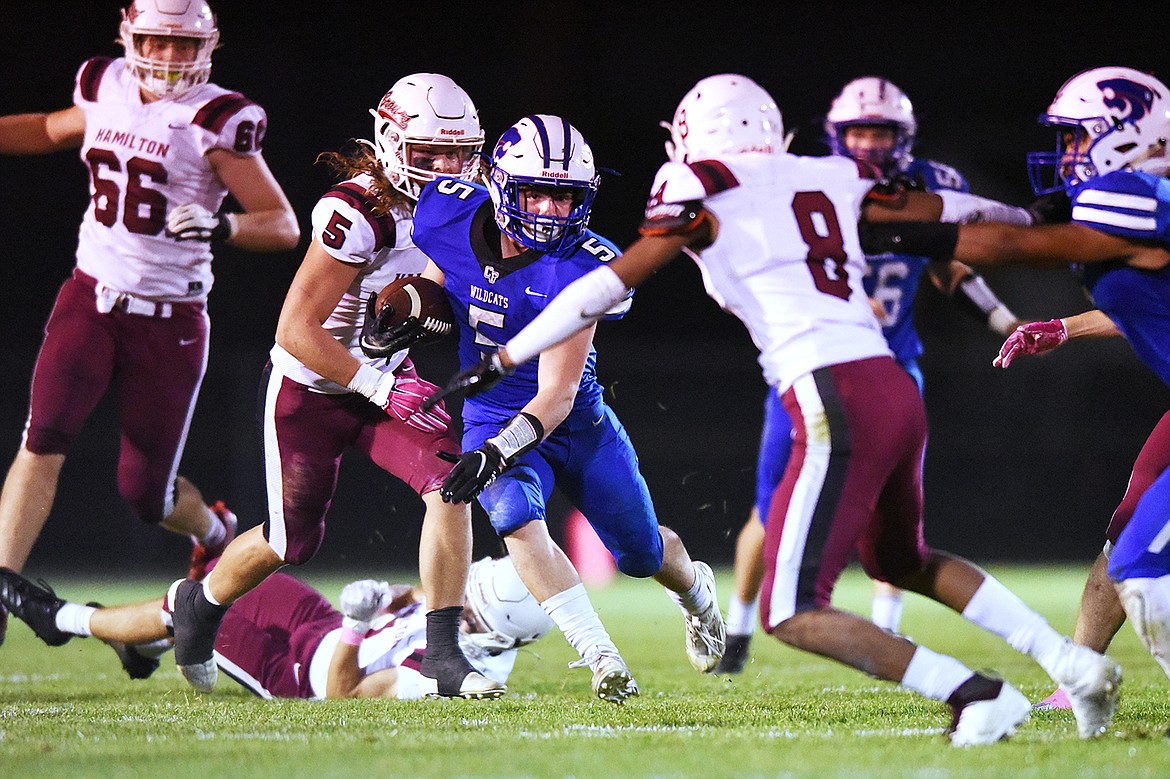 Columbia Falls running back Isaiah Roth (5) looks for room to run against Hamilton in the third quarter at Satterthwaite Memorial Field in Columbia Falls on Friday. (Casey Kreider/Daily Inter Lake)