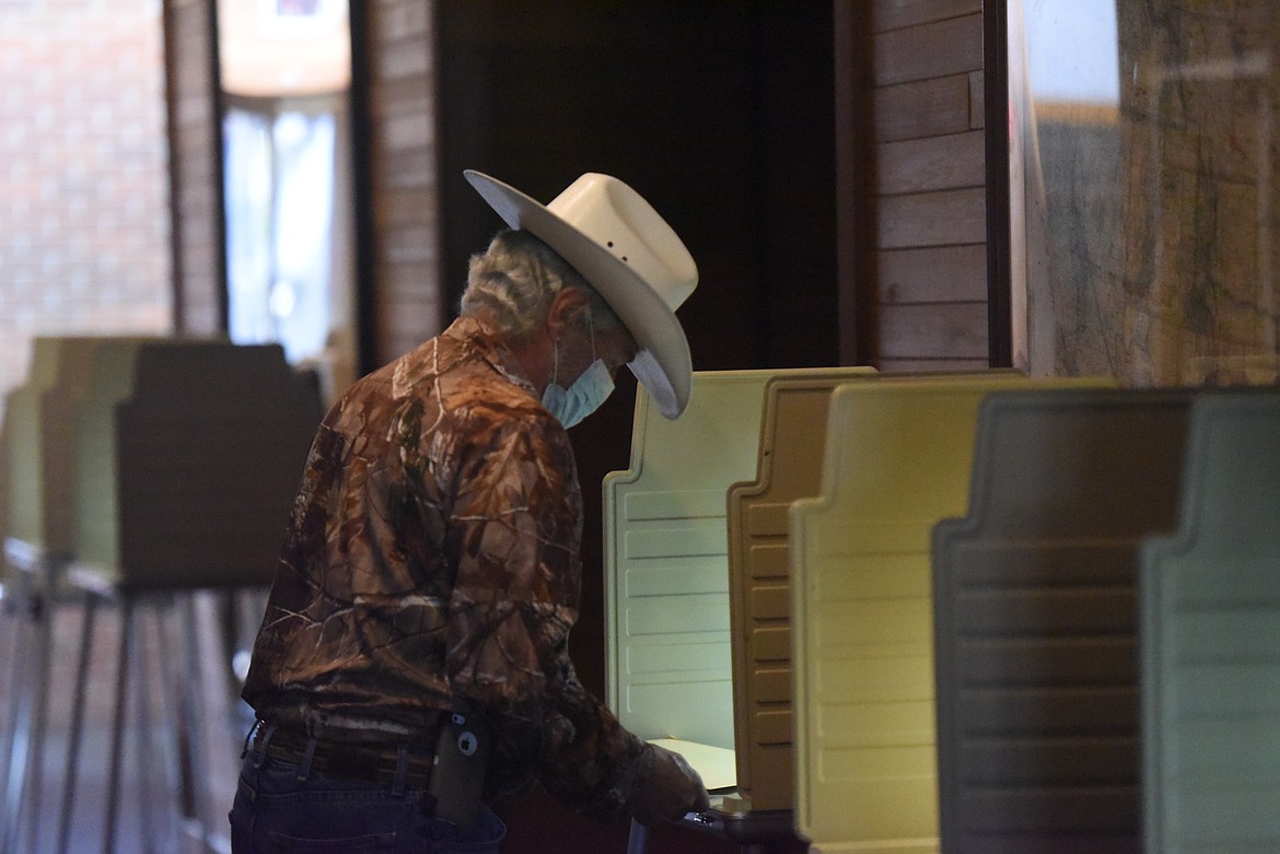 A voter fills out his ballot at the Lincoln County Courthouse on Oct. 7. Ballots were mailed out to active Lincoln County voters on Oct. 9.