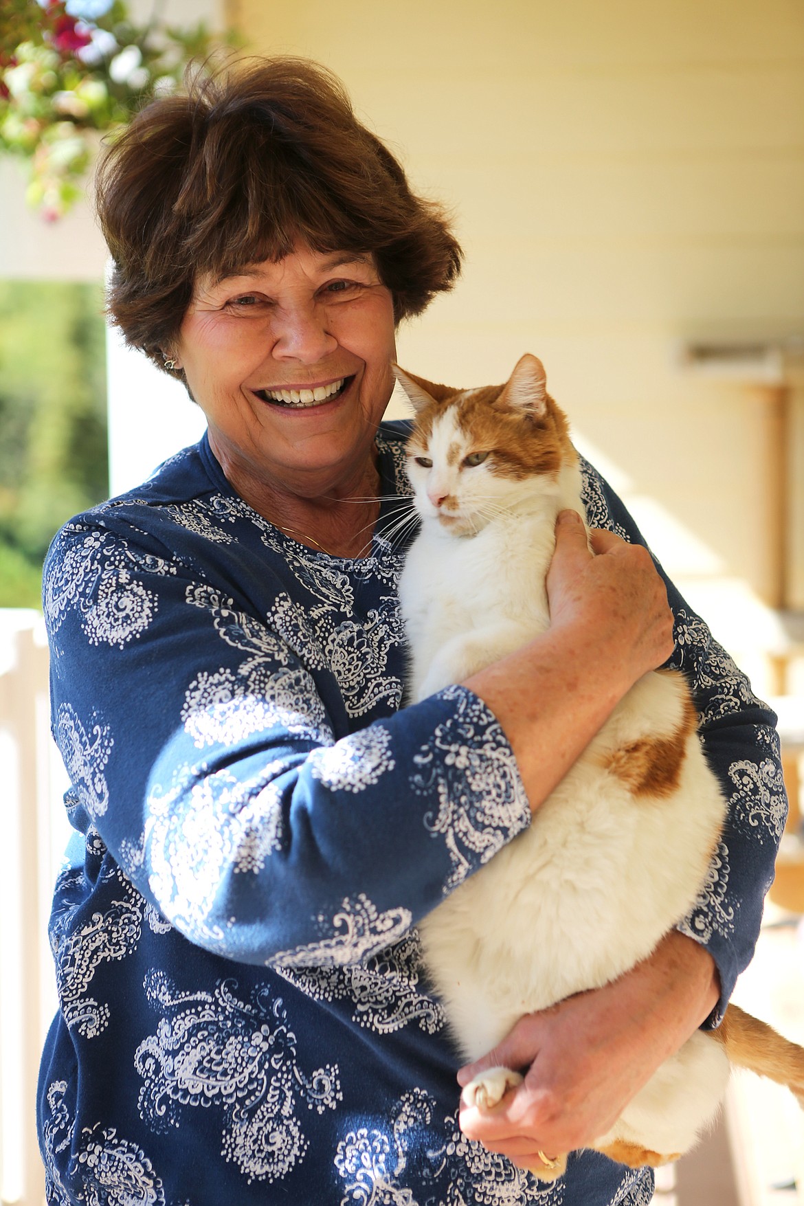 Darcy Albert, founder of Kitty MOM's Rescue is pictured with one of her cats the afternoon of Sept. 24 at her Kalispell home. 
Mackenzie Reiss/Daily Inter Lake