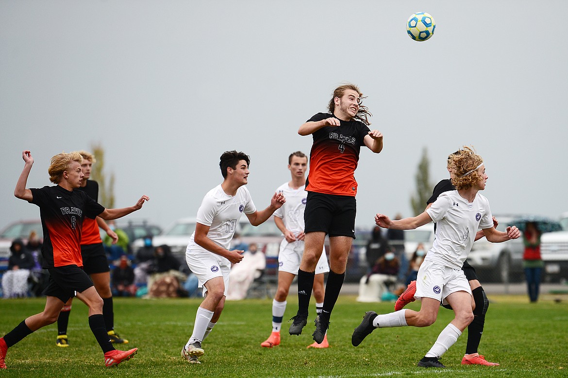 Flathead’s Aiden Christy (4) directs a header towards the Butte goal in the second half at Kidsports Complex on Saturday. (Casey Kreider/Daily Inter Lake)