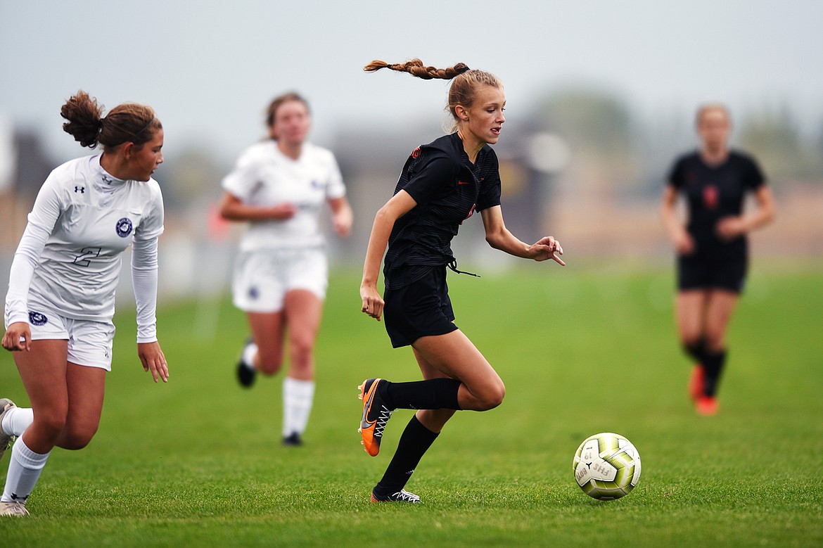 Flathead’s Mia Stephan (11) pushes the ball towards the Butte goal in the first half at Kidsports Complex on Saturday. (Casey Kreider/Daily Inter Lake)