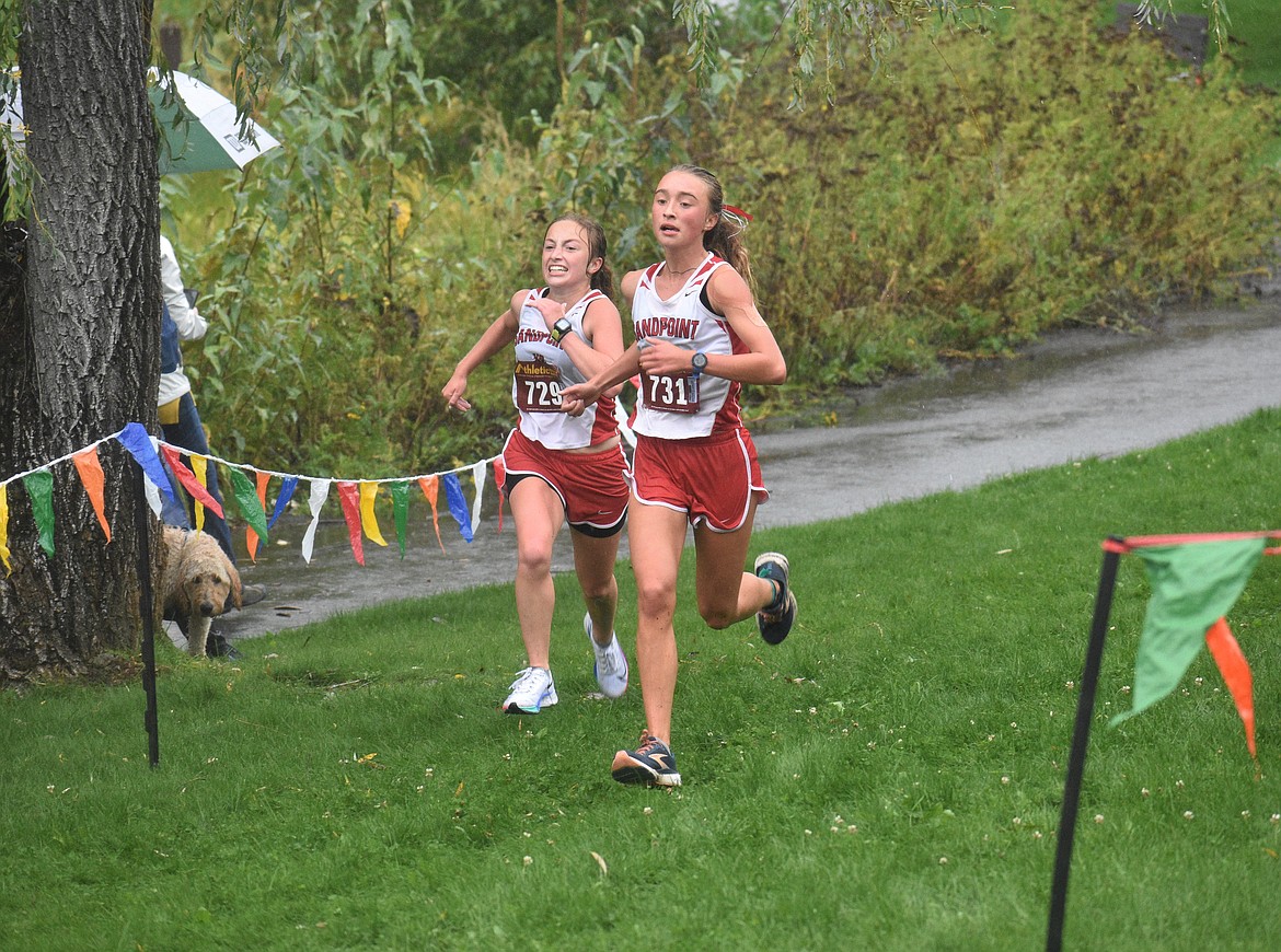 Camille Neuder (left) and Grace Rookey near the finish of Saturday's William Johnson Sandpoint Invitational.