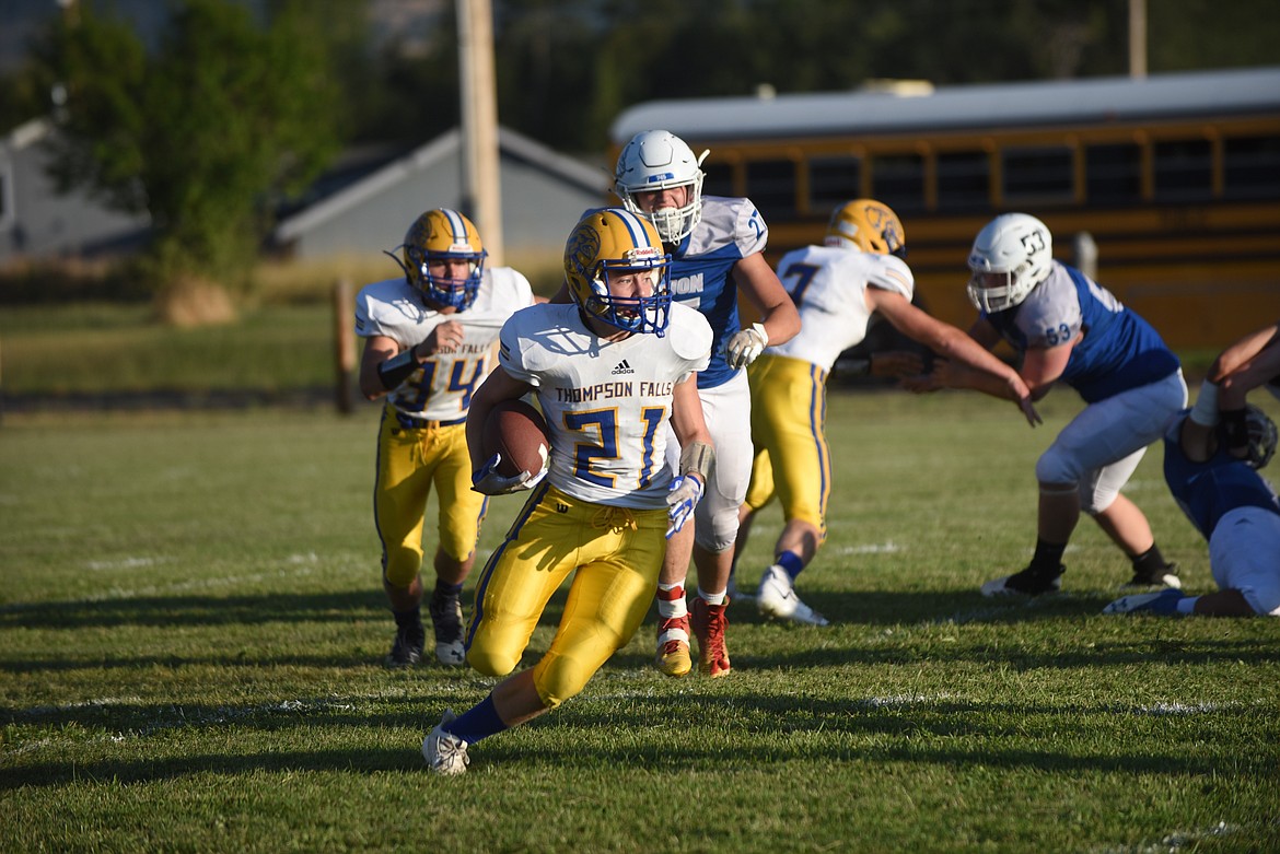 Thompson Falls' Trae Thilmony, shown here against Mission earlier this season, had a standout game for the Blue Hawks last Friday against Troy. Thilmony had three sacks while adding 63 yards rushing and one touchdown as the Blue Hawks won, 75-0. (Scott Shindledecker/Valley Press)