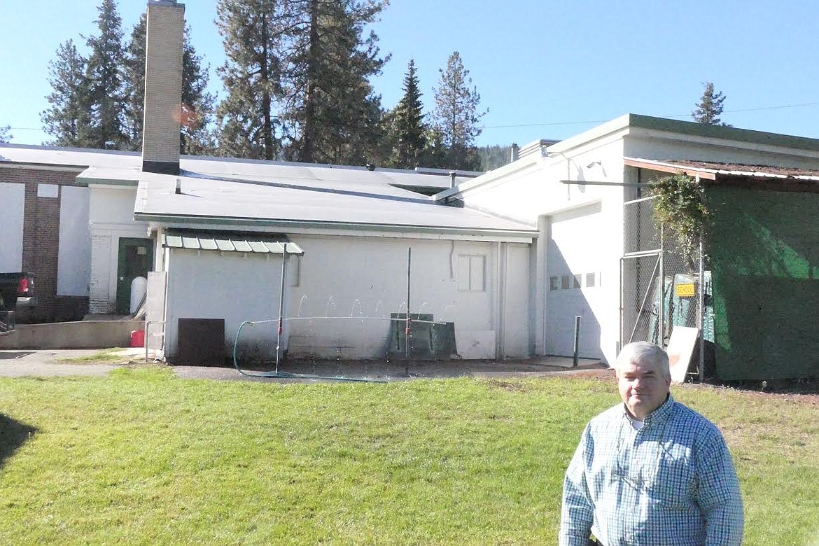 St. Regis School Superintendent Joe Steele stands in front of a section of the school which had new roofing installed. (Chuck Bandel/Valley Press)