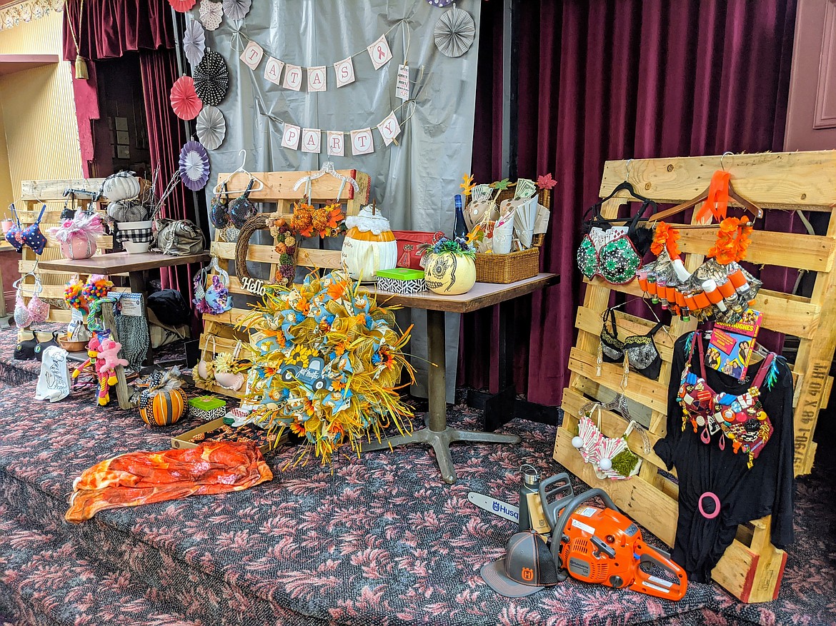 Custom bras and other live auction items are displayed in the Wallace Elks dining room during the 9th annual Tata's Party.