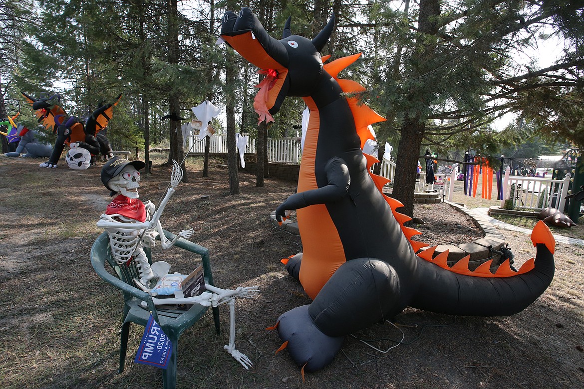 A skeleton and dragon are part of the Halloween displays outside the home of Mike and Debbie Bendig of Spirit Lake.