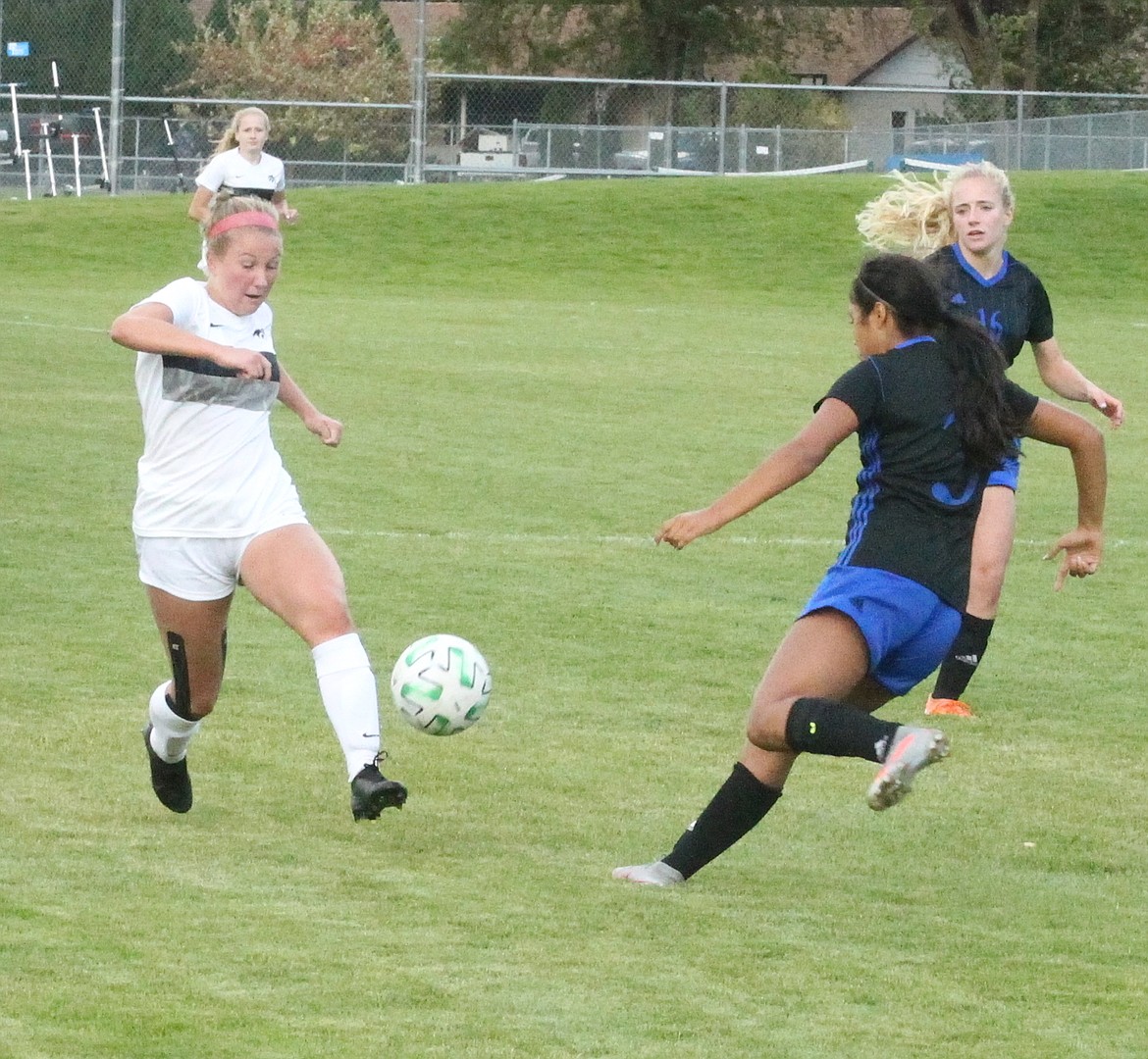 JASON ELLIOTT/Press
Lake City junior forward Taytum Curtis dribbles upfield past Coeur d'Alene junior defender Sofia Allan during the second half of Tuesday's 5A Region 1 girls soccer championship match.