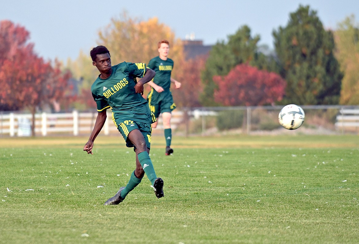 Whitefish senior Marvin Kimera takes a shot in close range during the Bulldogs rout of Polson Thursday, Oct. 8. (Whitney England/Whitefish Pilot)