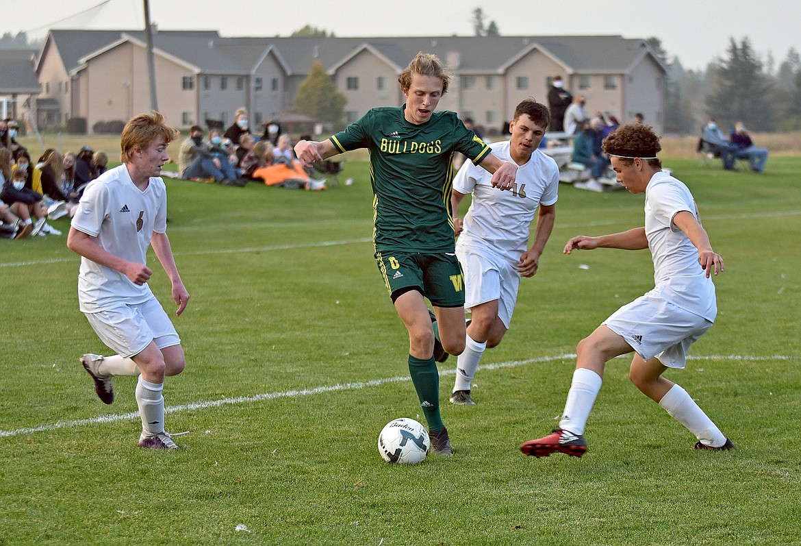 Whitefish junior Darby McCarthy takes on three defenders during a game against Polson at Smith Fields on Thursday, Oct. 8. (Whitney England/Whitefish Pilot)