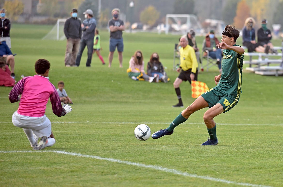 Whitefish's leading goal scorer and senior Brandon Mendoza challenges Pirate keeper Tristian Clifford during a game against Polson at Smith Fields on Thursday, Oct. 8. (Whitney England/Whitefish Pilot)