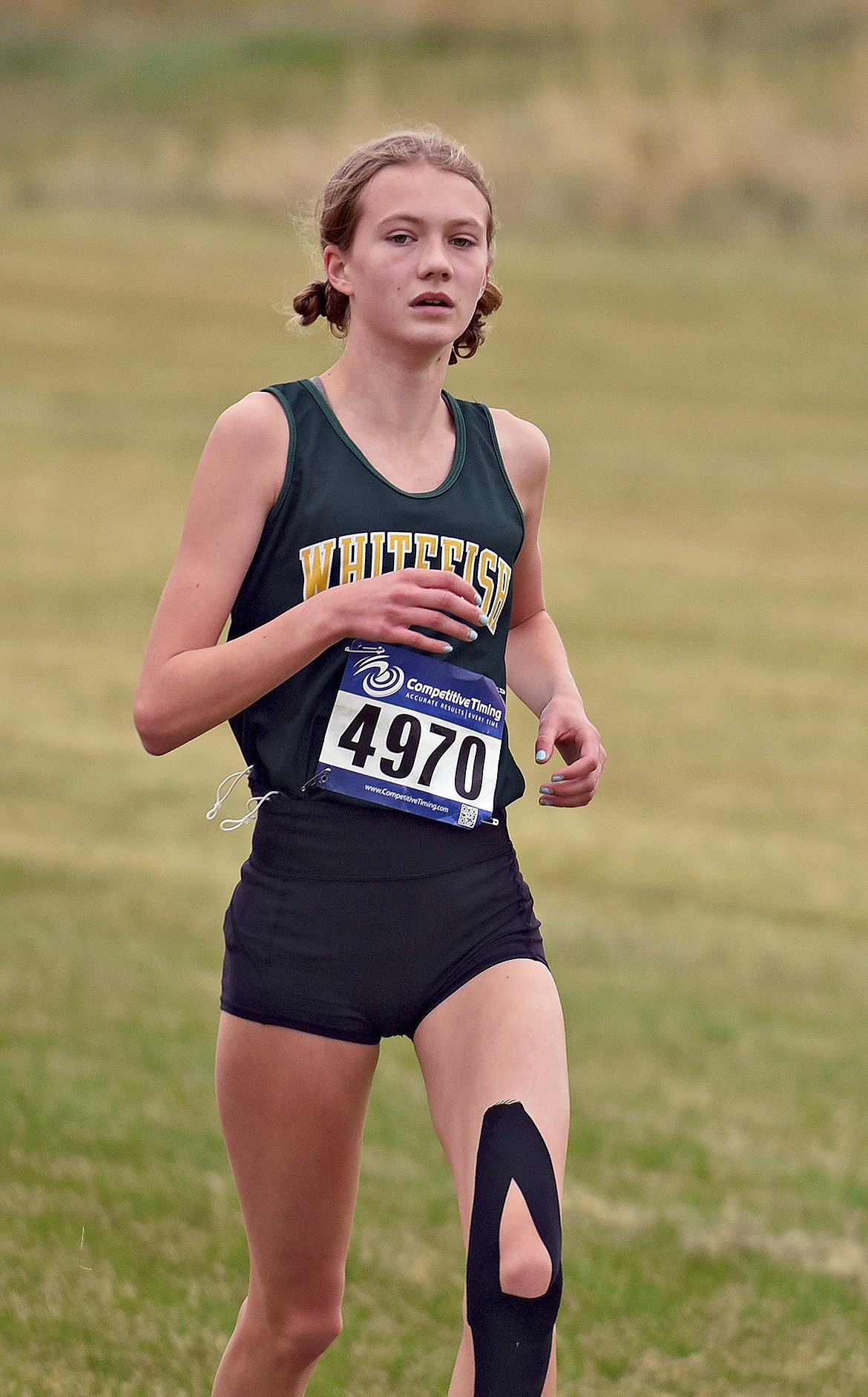 Whitefish girls team leader Paetra Cooke runs to a 9th place finish at the Western A Invite cross country meet at Rebecca Farm Saturday. (Whitney England/Whitefish Pilot)