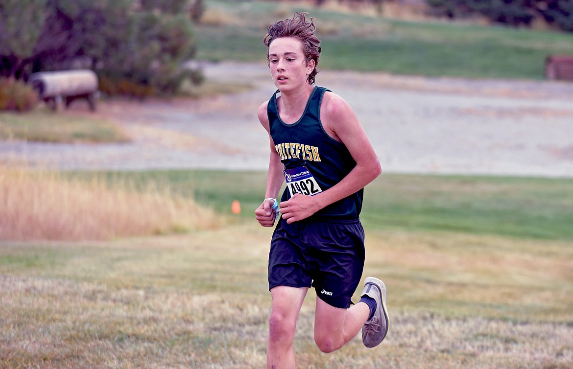 Whitefish freshman runner Deneb Linton competes to a fourth place finish at the Western A Invite cross country meet on a cloudy day at Rebecca Farm Saturday. Linton achieved a personal record of 17:05 at the meet. (Whitney England/Whitefish Pilot)