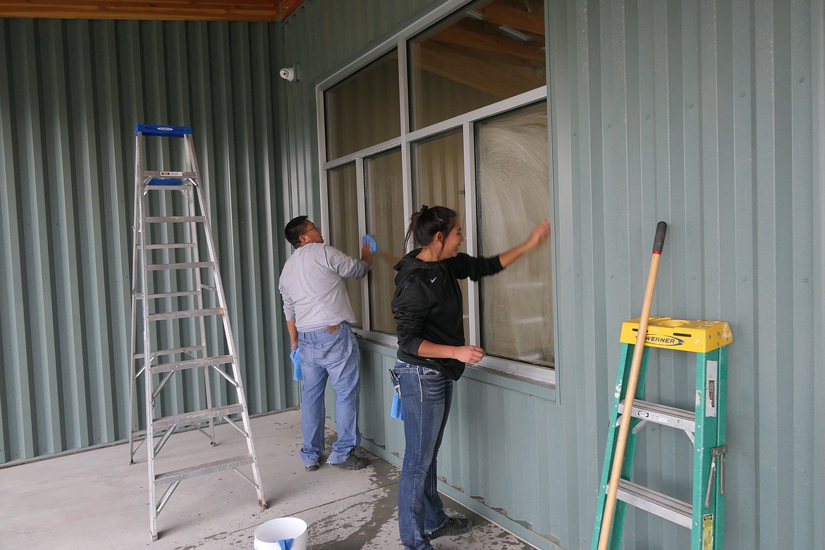 Students will be welcomed with sparkly windows next week thanks to John Grandchamp and his daughter, Jesse Pepion, of Grandchamp Window and Carpet Cleaning, who volunteered their expertise. John is unit director for the Ronan site. (Carolyn Hidy/Lake County Leader)