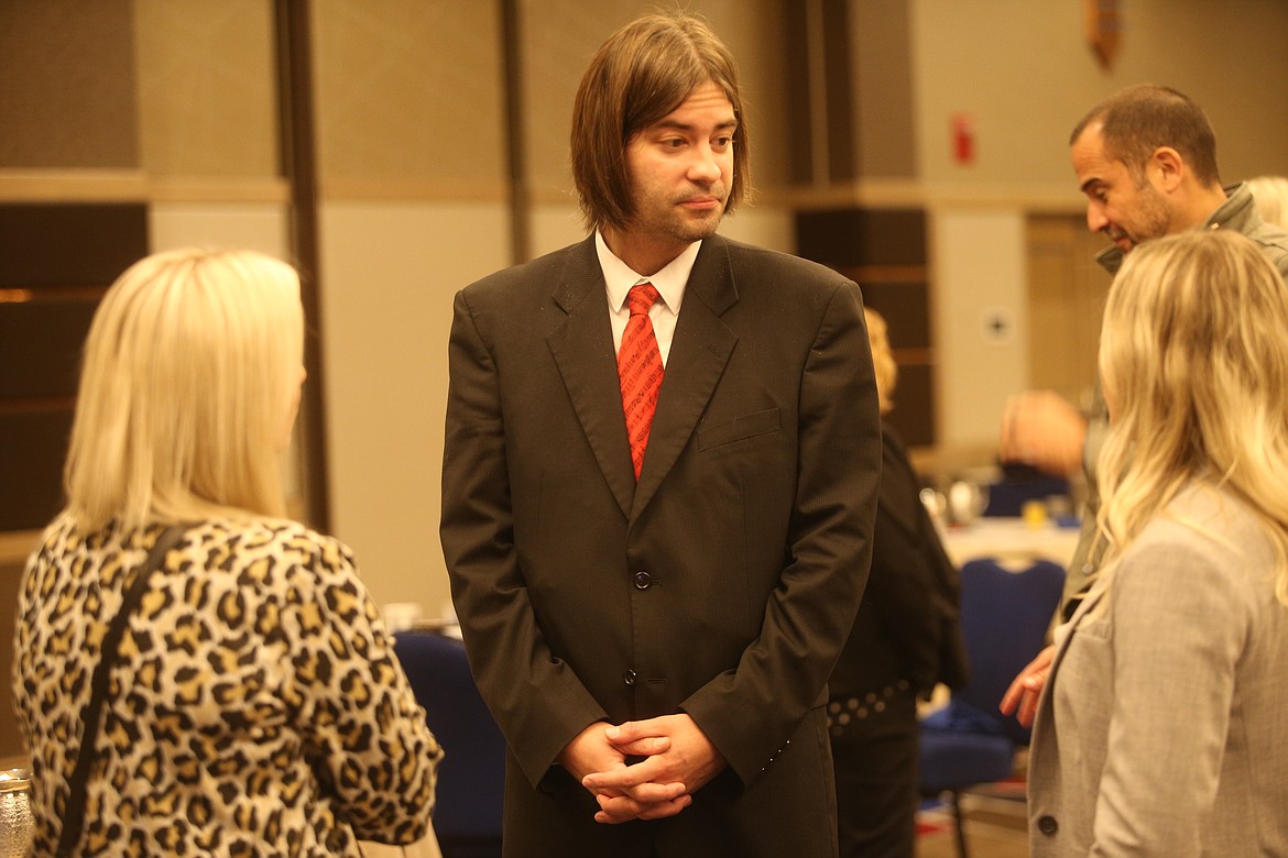 Jan Pellant, conductor of the Coeur d’Alene Symphony, visits with guests after giving a presentation at the Coeur d'Alene Regional Chamber of Commerce's Upbeat Breakfast at The Coeur d'Alene Resort.