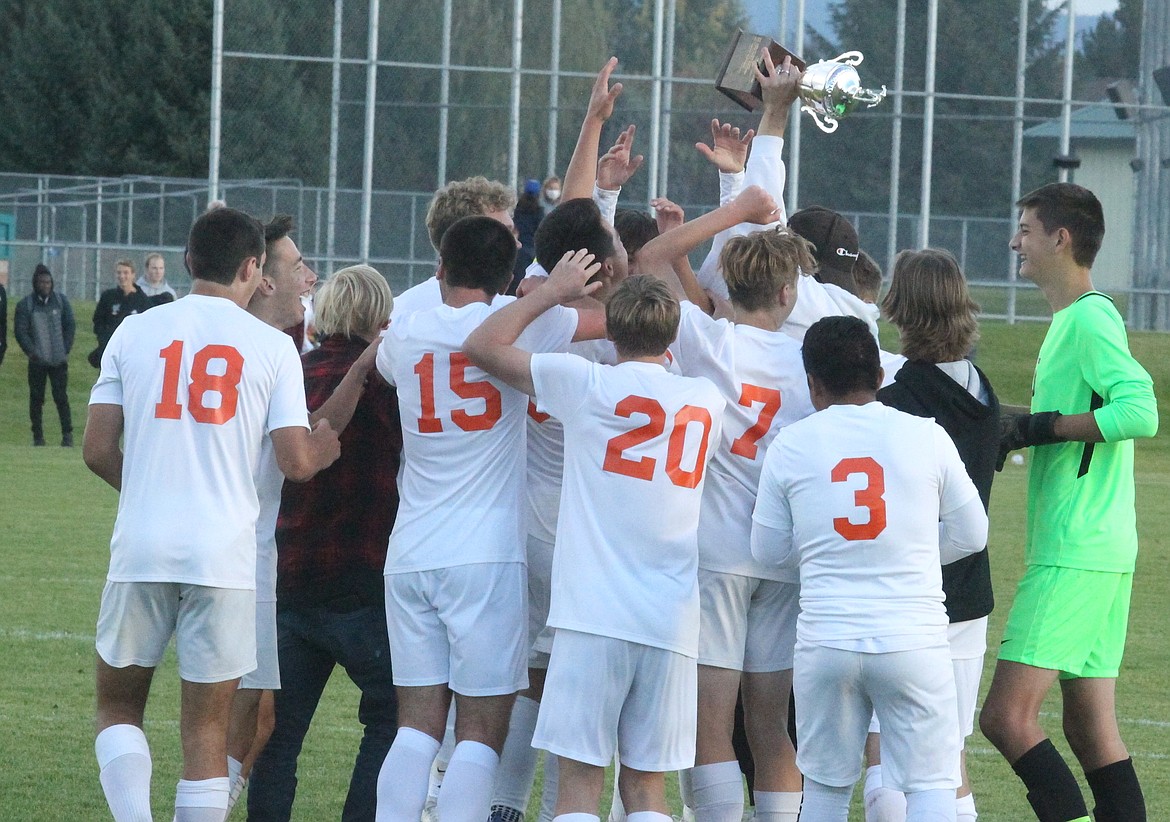 JASON ELLIOTT/Press
Members of the Post Falls boys soccer team celebrate following a 1-0 win over the Lake City Timberwolves in the 5A Region 1 soccer championship match on Wednesday at the Irma Anderl Soccer Complex.