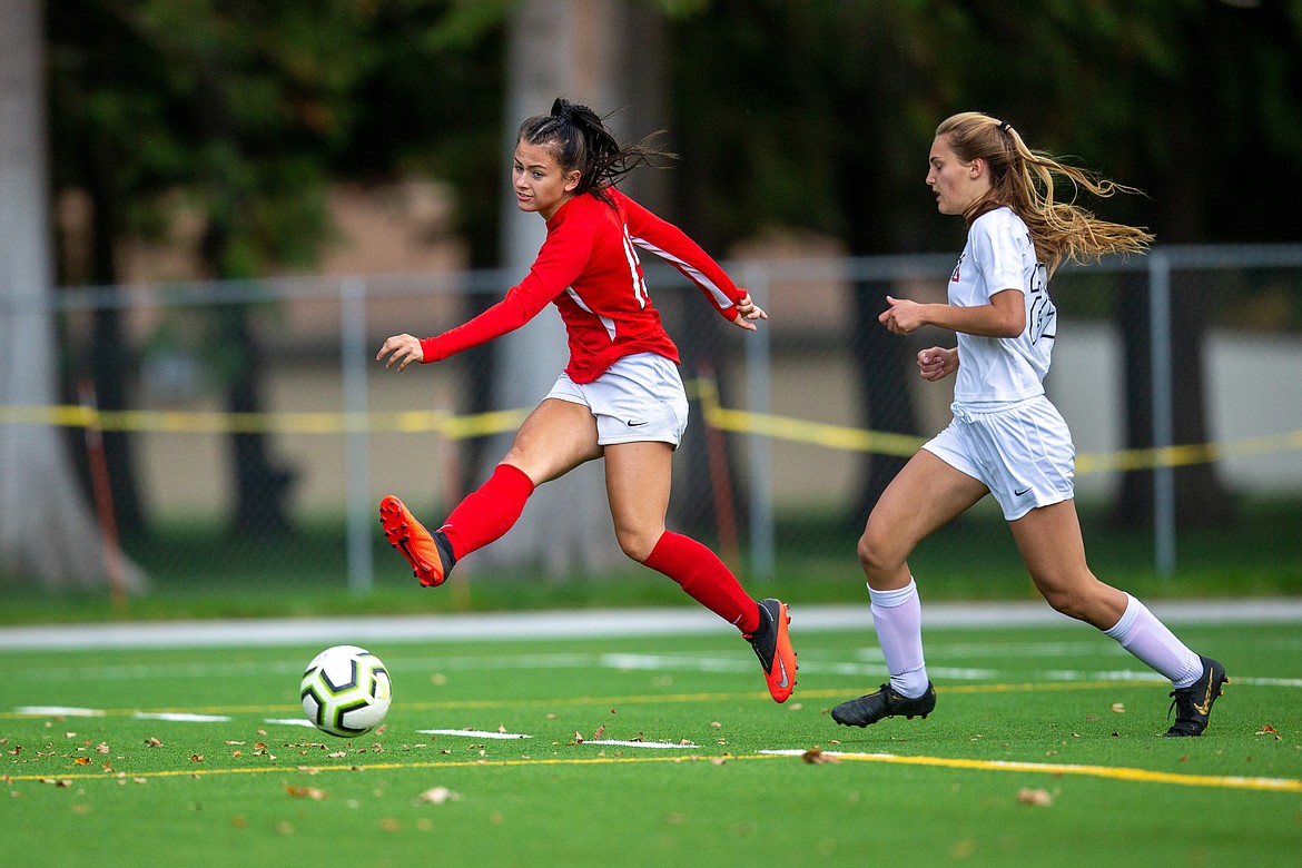 Senior Jordie Breeden fires a shot into the back of the net during a match against Moscow on Sept. 24 at War Memorial Field.