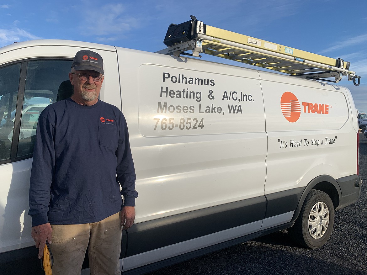 Polhamus Heating & A/C Technician Dave Grant beside one of the company vans. Grant, and other technicians, see an uptick in service calls from customers about their heating units typically around this time of year as the weather gets cooler.