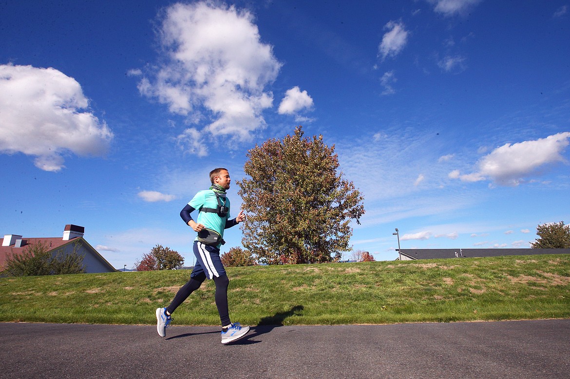 Ryan Worthen runs along the North Idaho Centennial Trail as he nears the finsh of his journey of nearly 500 miles across Washington state to the family home in Rathdrum.