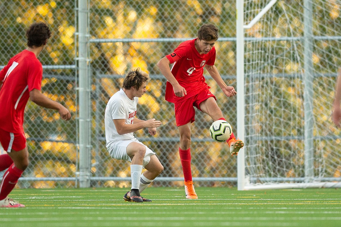Sophomore defender Evan Dickinson clears the ball during the second half of the 4A Region 1 final against Moscow on Oct. 15.