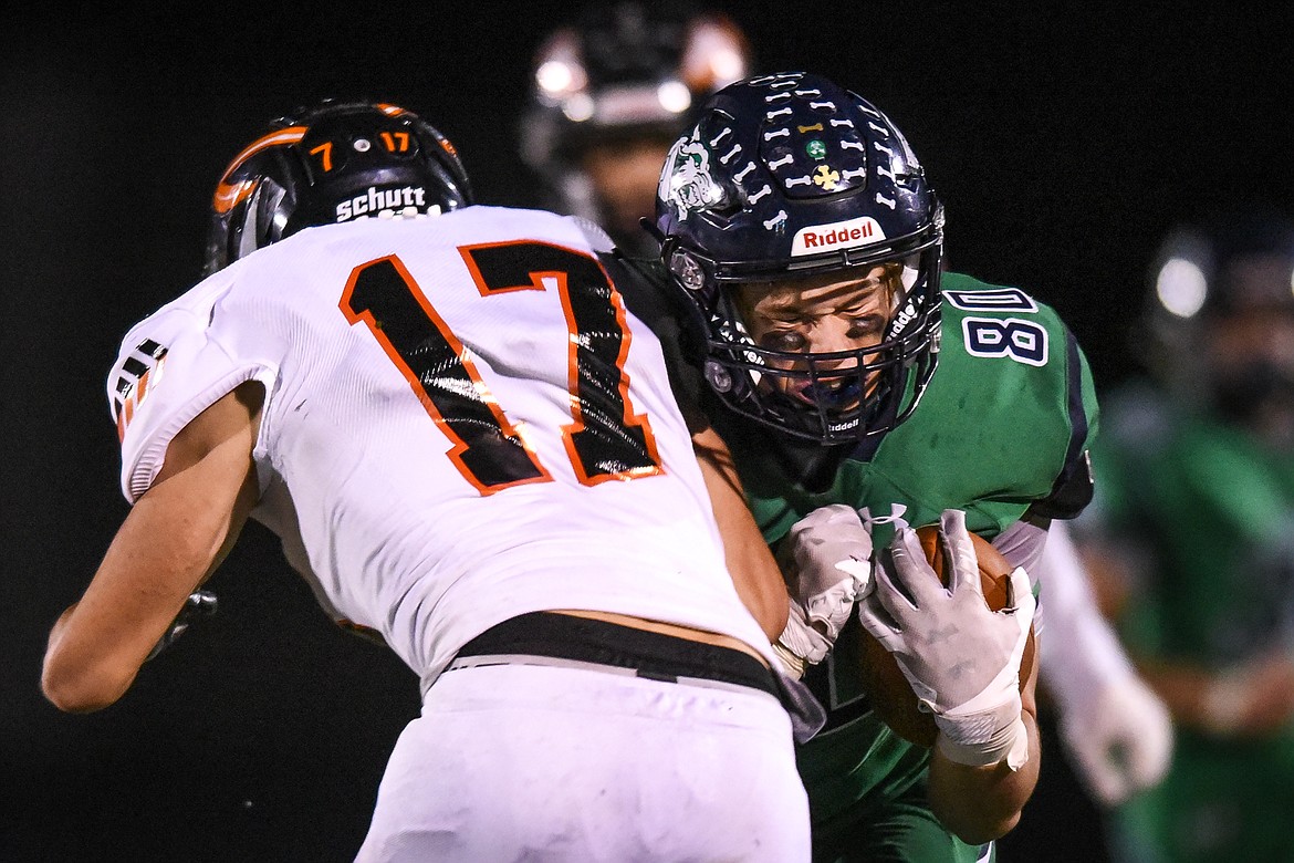 Glacier tight end Ethan Diede (80) collides with Flathead linebacker Dylan Zink (17) on a third quarter reception during crosstown football at Legends Stadium on Friday. (Casey Kreider/Daily Inter Lake)