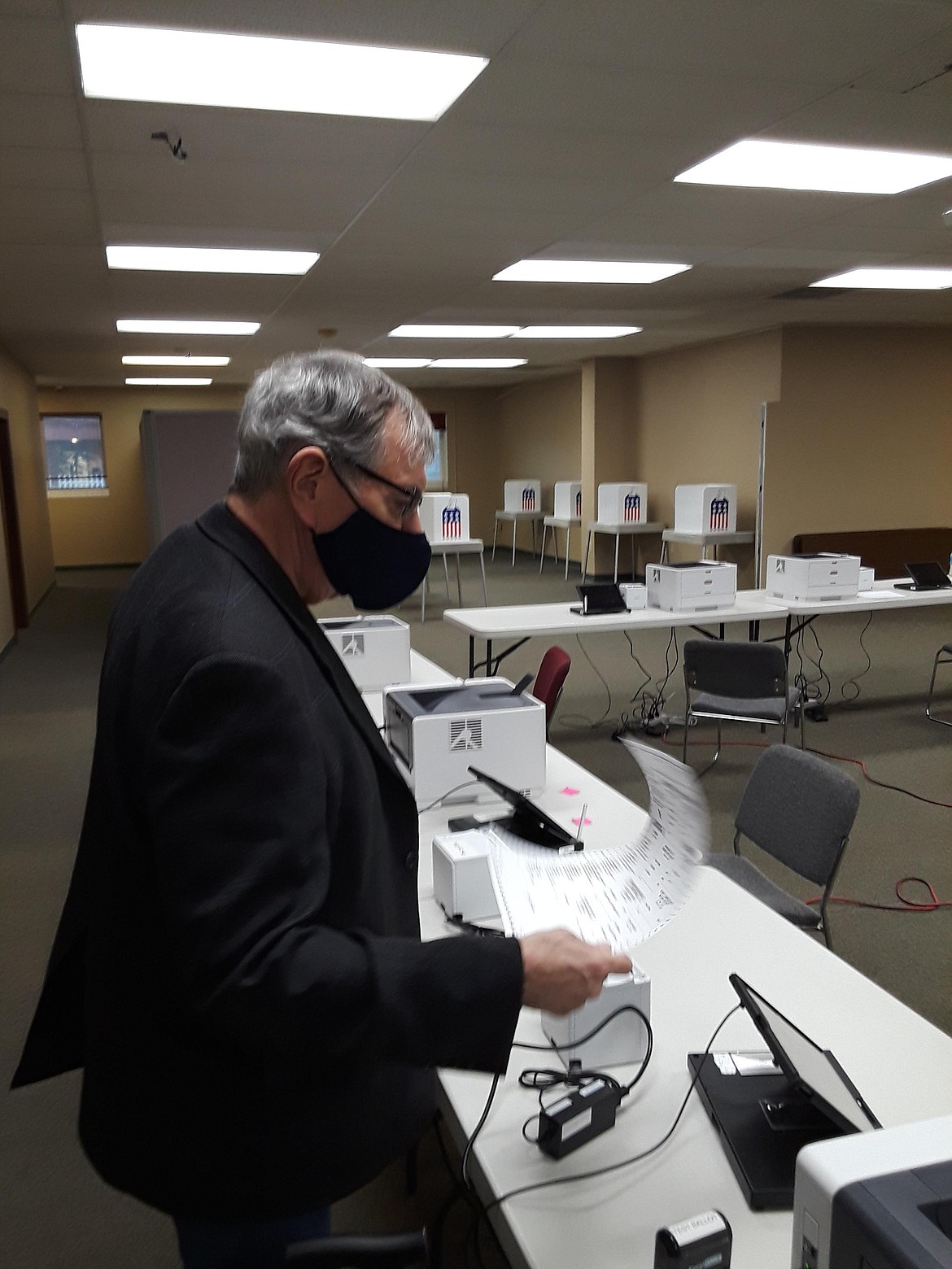 Kootenai County Clerk Jim Brannon awaits his ballot in a Friday test run leading up to Monday's early voting at the county's Elections Office on Third Street in Coeur d'Alene. Eight stations will be running simultaneously at the office for those who would like to vote early. (CRAIG NORTHRUP/Press)