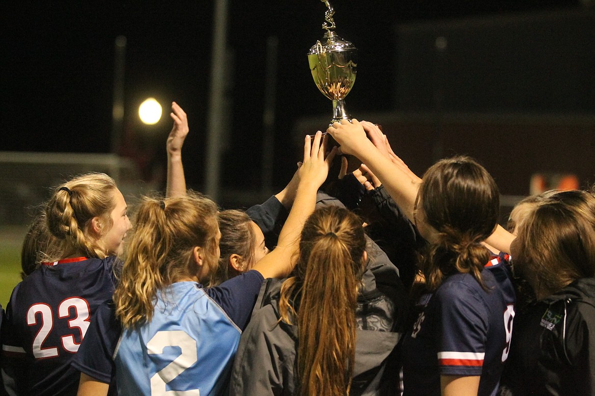 JASON ELLIOTT/Press
Members of the Coeur d'Alene Charter Academy girls soccer team celebrate a fifth-straight 3A District 1-2 championship after beating Timberlake 9-0 at The Fields at Real Life Ministries in Post Falls on Saturday.