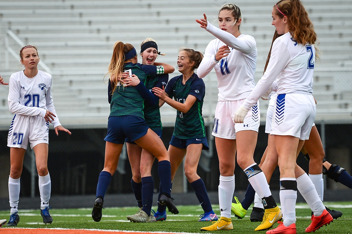Glacier's Madison Becker (18), Reese Leichtfuss (7) and Reagan Brisendine (3) celebrate after Leichtfuss' scored a goal off a header from a corner kick in the first half against Billings Skyview at Legends Stadium on Saturday. (Casey Kreider/Daily Inter Lake)