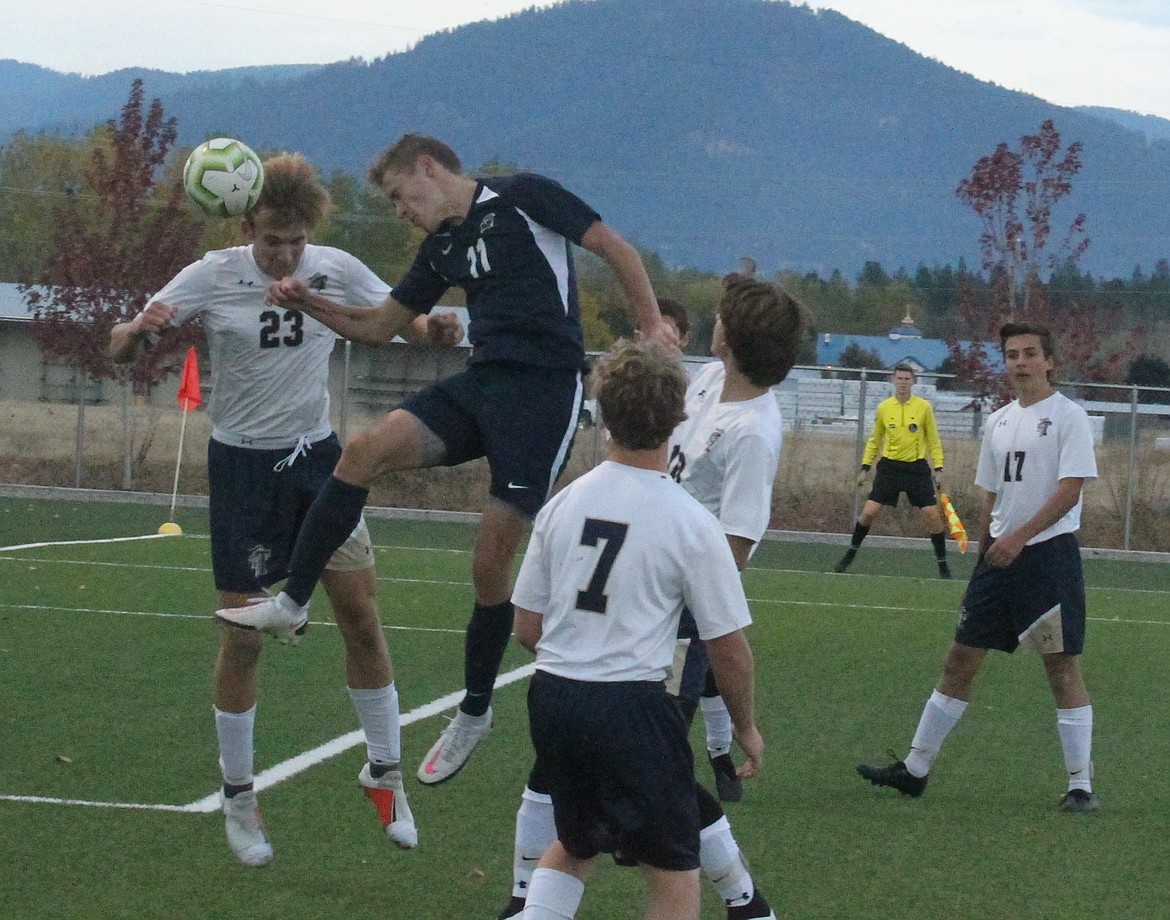 JASON ELLIOTT/Press
Timberlake senior midfielder Michael Simpson attempts to deflect the ball away from Coeur d'Alene Charter senior defender Jordan Gallegos during Saturday's match at The Fields at Real Life Ministries in Post Falls.