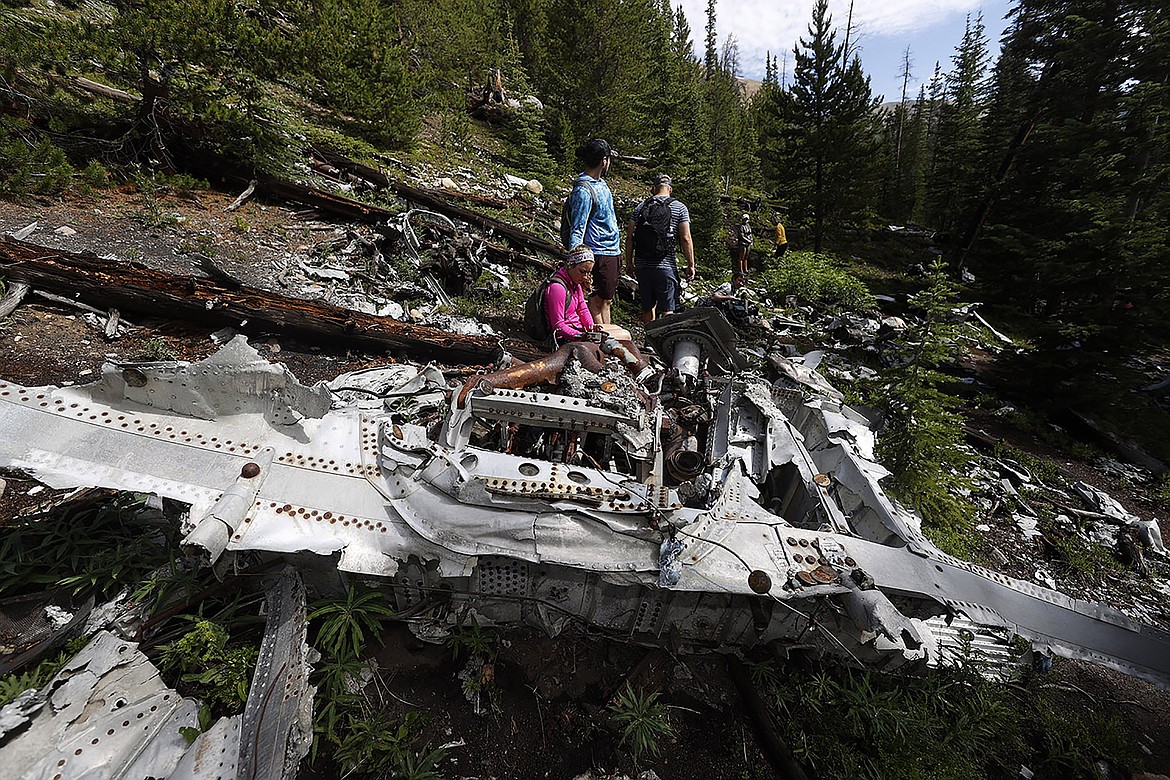 DAVID ZALUBOWSKI/Associated Press
Relatives of members of the 1970 Wichita State University Shockers football team visit the crash site in July where an airplane carrying some of the players crashed near Loveland Pass, west of Silver Plume, Colo. Wreckage from the plane, which was one of two being used to take the Shockers to play a football game against Utah State University in Logan, Utah, is still scattered on the mountain top nearly 50 years after the crash close to the Eisenhower Tunnel.