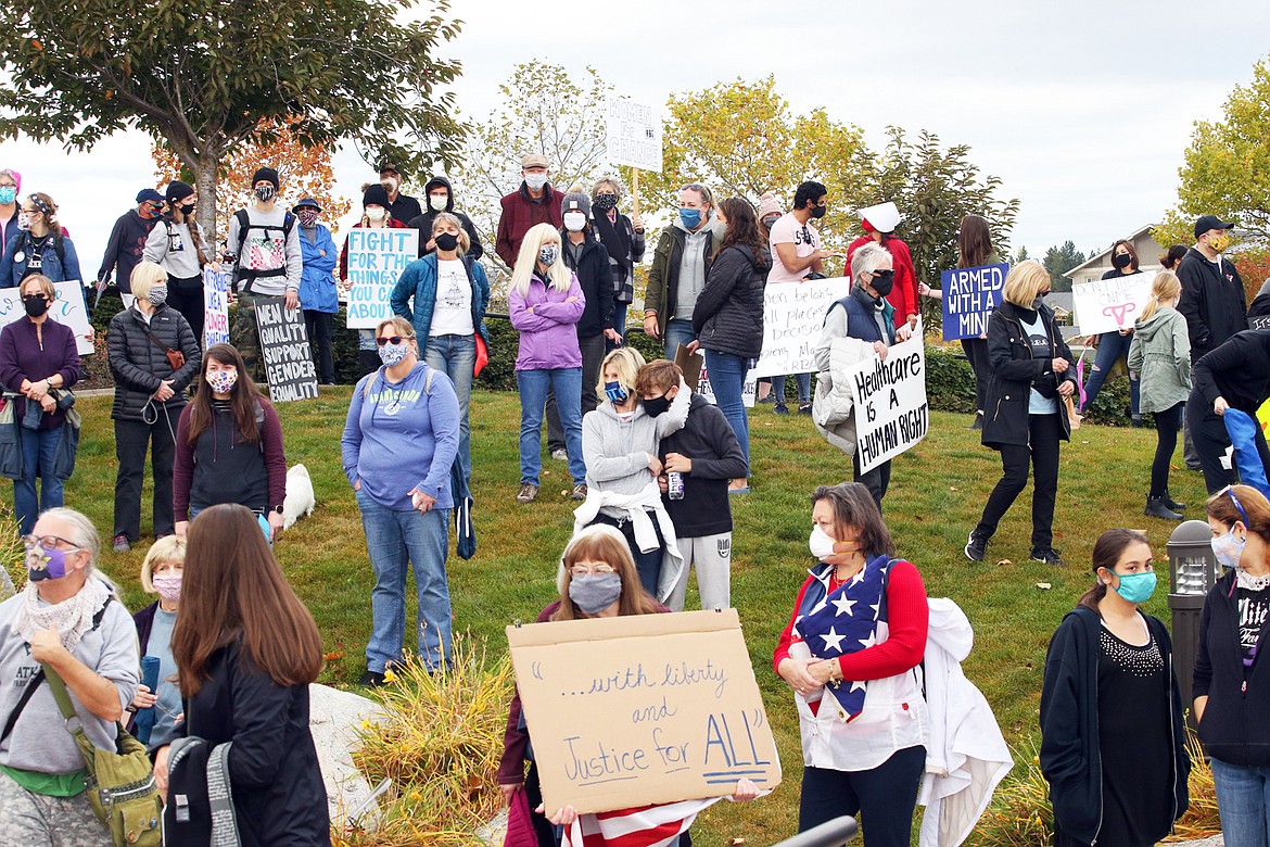 Some of Saturday's crowd for the women's march and rally unite at Riverstone Park.