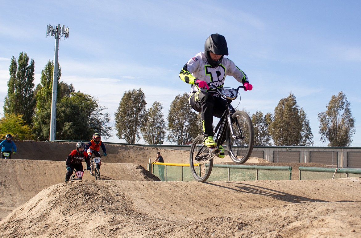 Kyler Esmay leads the pack as they make their way around the track on Saturday afternoon at the final event of the season for Moses Lake BMX.