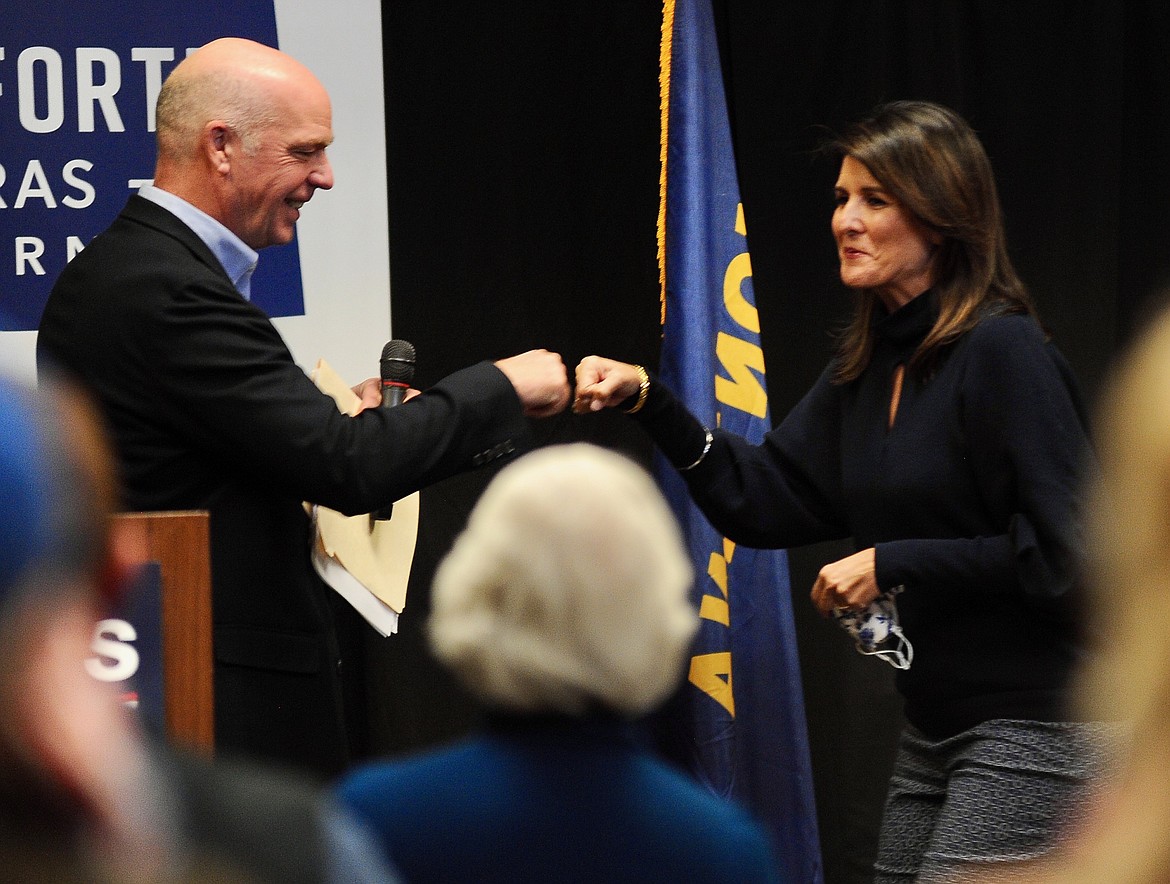 U.S. Rep. Greg Gianforte, R-Montana, bumps fists with Nikki Haley, former U.S. ambassador to the United Nations and South Carolina governor, speaks at a Montana Republican Party campaign event at the Red Lion conference center in Kalispell on Monday. (Matt Baldwin/Daily Inter Lake)