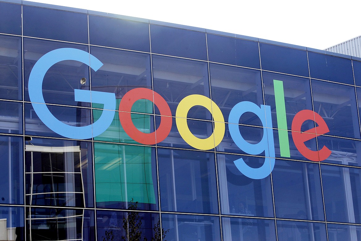 FILE - In this Sept. 24, 2019, file photo a sign is shown on a Google building at their campus in Mountain View, Calif. The Justice Department is expected to file a lawsuit Tuesday alleging that Google has been abusing its online dominance in online search to stifle competition and harm consumers. The litigation marks the government’s most significant act to protect competition since its groundbreaking case against Microsoft more than 20 years ago. The suit could be an opening salvo ahead of other major government antitrust actions, given ongoing investigations of major tech companies including Apple, Amazon and Facebook at both the Justice Department and the Federal Trade Commission. (AP Photo/Jeff Chiu, File)