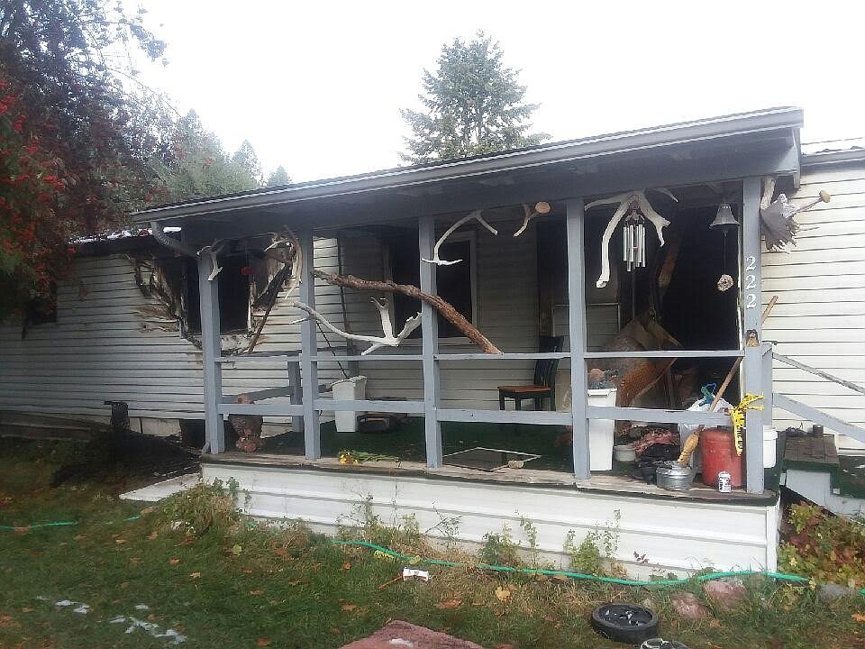 A fire at a residence at Forest Hill Village near Somers claimed the life of a Flathead Valley man Saturday. The interior of the home was heavily damaged. Another local man was arrested on pending felony arson charges in connection with the incident. (Scott Shindledecker/Daily Inter Lake)