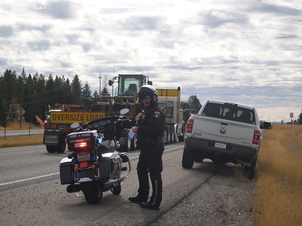 Idaho State Police Trooper Rob Davis said working on the side of the road can be dangerous when motorists don’t change lanes or slow down. “I’ve had vehicles come so close they almost knocked my bike over,” he said. (MEGAN SAUSSER/ITD)