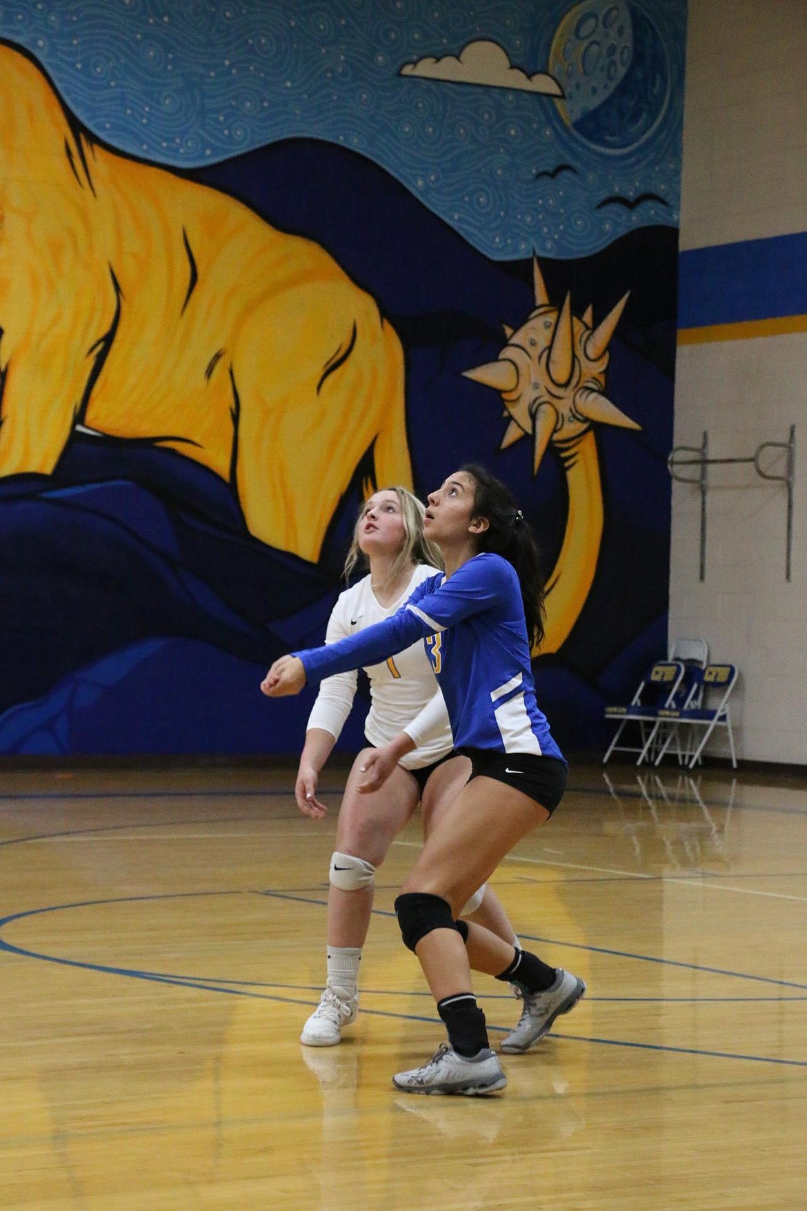 Sophomore Emily Myers prepares to receive a ball during Tuesday's match against Kootenai.