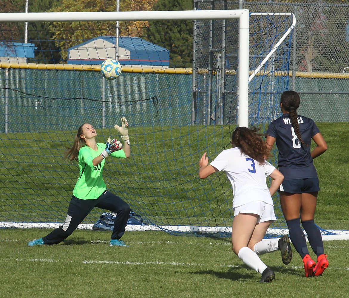 MARK NELKE
Lake City goalkeeper Hailey Jo Parks had 10 saves on Thursday, including this one of a close-in shot by Hayden Wilsey from Timberline of Boise. Helping on defense for Lake City is Kali McKellips (8).