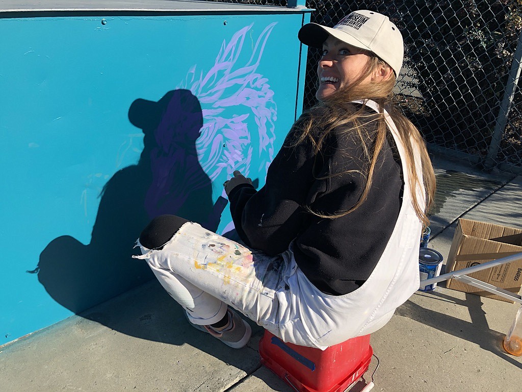 Erika Kovalenko, artists and museum coordinator at the Moses Lake Museum and Art Center, working on a dragon in the city skate park, part of her effort to beautify the park.