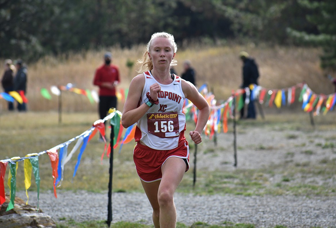 Junior Mackenzie Suhy-Gregoire crosses the finish line at the regional championships on Thursday at Farragut State Park. She won the girls district title.